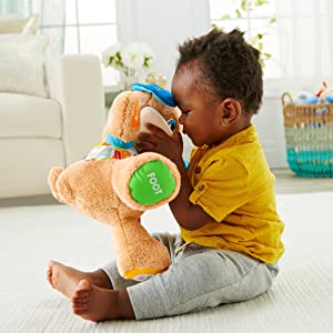 Fisher-Price Puppy Eveil Progressif jouet bébé, peluche interactive, plus de 50 chansons