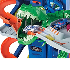 Hot Wheels City Super Dino Robot Garage avec T-Rex, pour contenir jusqu’??100 petites voitures