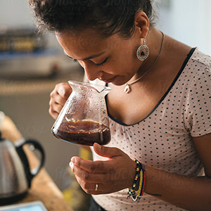 woman smelling coffee