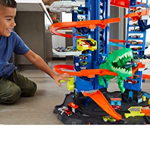 Hot Wheels City Super Dino Robot Garage avec T-Rex, pour contenir jusqu’??100 petites voitures